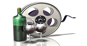 Calici di vino con bottiglia, su sfondo con bobina cinematografica per "Camineras in Bingia", percorso cinematografico per le strade del vino - Dolianova - 1, 8 e 22 Dicembre 2013 - ParteollaClick